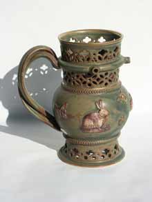 green and gold puzzle jug