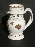white and gold puzzle jug